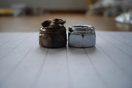 Melted nut on left and new nut on right
