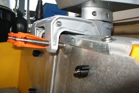 C-clamp cups located UNDER the steel bracket.