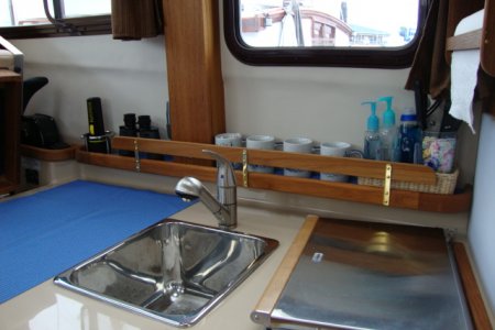 Teak fiddles added at sink
