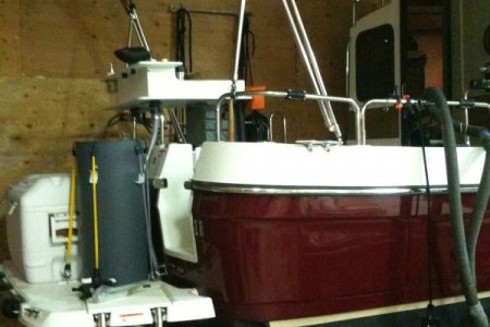 B.  Side view bait station with boat in shop
