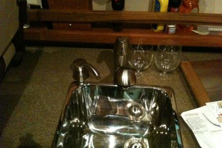 Q. soap dispenser and extra teak railing for storage