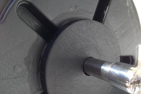 Homemade flange/adapter JB Welded on plastic spool.