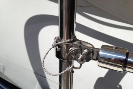 Spool "axle" mounted using off-the-shelf fittings. This end cap is JB Welded on shaft.