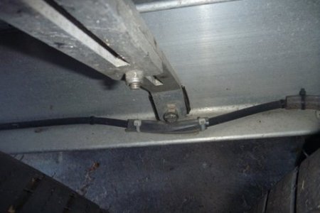 Trailer stuff convyor belt material to isolate fender from vibration. Tubing over brake line to prevent chaffing