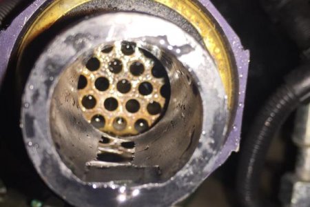 Inlet (starboard side) of transmission cooler after flushing from outlet side.