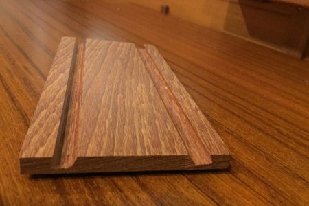 Stand without iPad. Each slot has a different angle. A thicker board would allow a deeper slot and thus more stable in rough sea