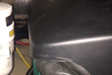 Cover cutout to stop coolant hose chafing