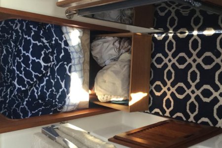 drawer under the cushion for clothes and still easy access to the area under it