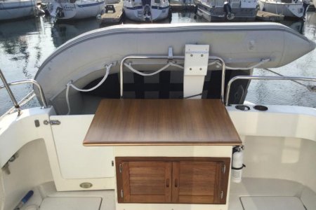 built a cockpit table it’s held on with headboard clips and a door hook.
