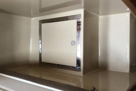 Cover to hatch providing access to Dometic A/C