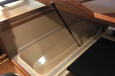 Gas Struts to assist.  Teak trim to finish. Camper Seal to silent.