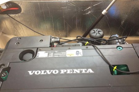 Power cord routed on top of engine to cabin