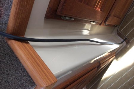 Power cord routed from floor compartment