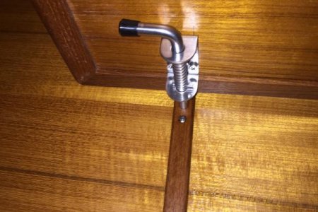 Pin engaged under table