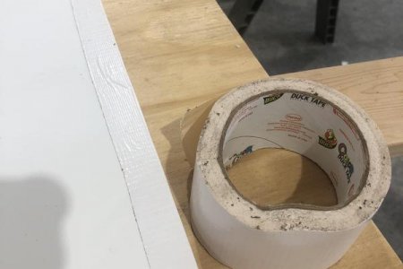 White Duck Tape to connect the two pieces of plastic sheeting.