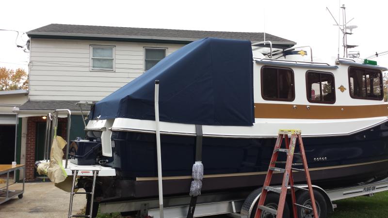 Canvas cockpit cover keeps canvas frame out of the weather and cockpit dry