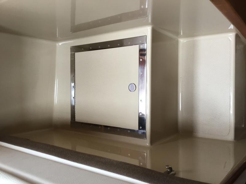 Cover to hatch providing access to Dometic A/C