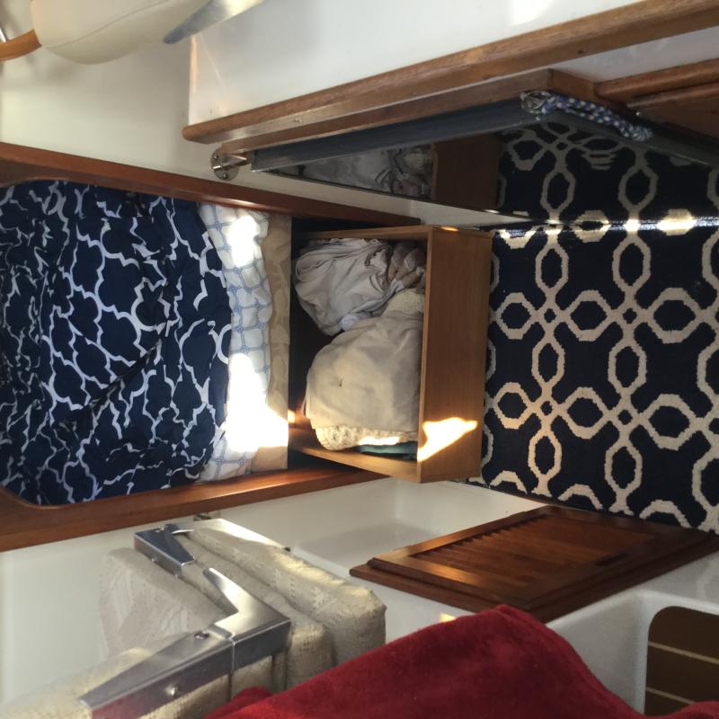 drawer under the cushion for clothes and still easy access to the area under it