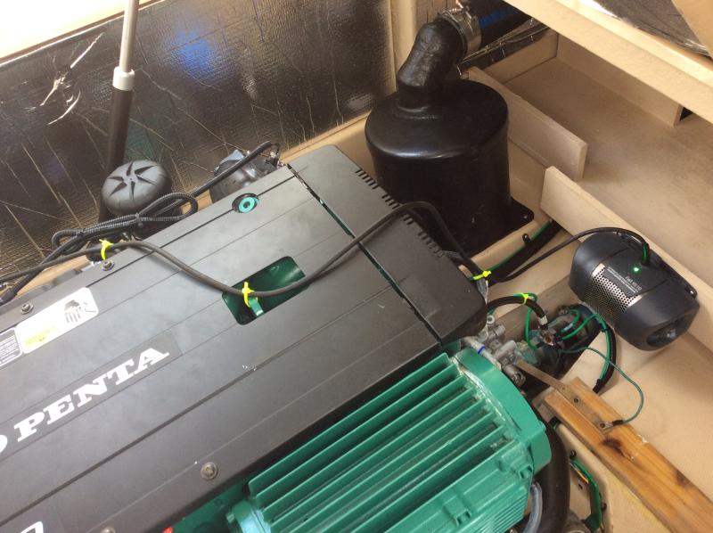PALI engine heater installed on wood shelf