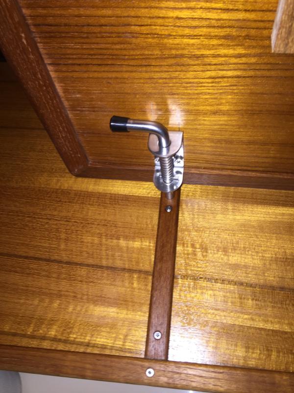 Pin engaged under table