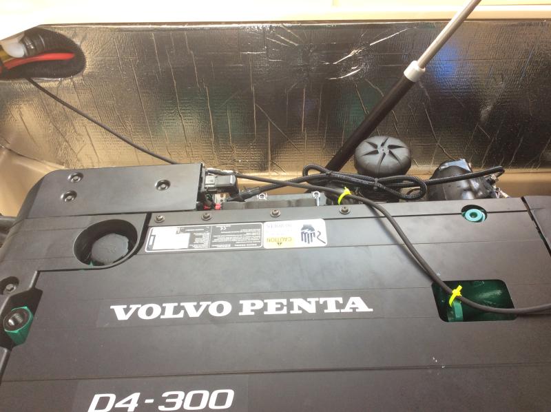 Power cord routed on top of engine to cabin