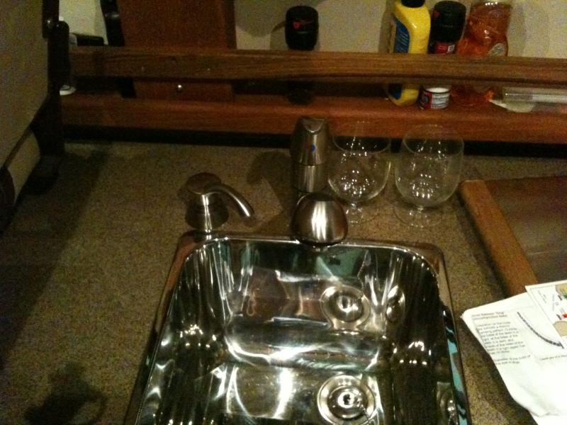 Q. soap dispenser and extra teak railing for storage