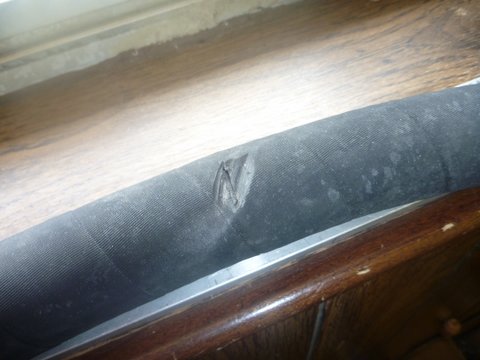 Raw water hose damage poorly routed from new