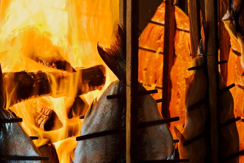 Silver salmon roasted in an open pit at Tillicum Village on Blake Island