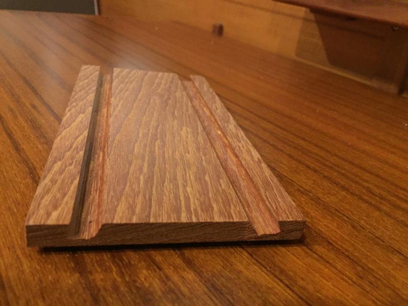 Stand without iPad. Each slot has a different angle. A thicker board would allow a deeper slot and thus more stable in rough sea