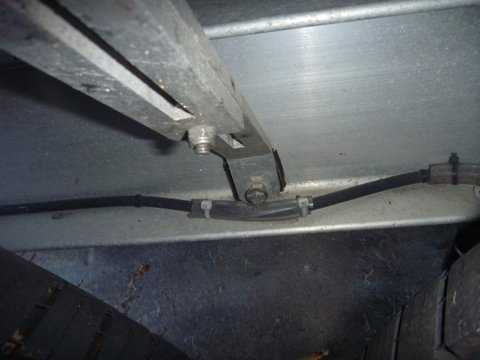 Trailer stuff convyor belt material to isolate fender from vibration. Tubing over brake line to prevent chaffing