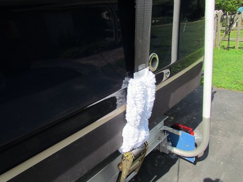 Trailer stuff wash mitts with front cut out to slide over our 4" gunnel strap